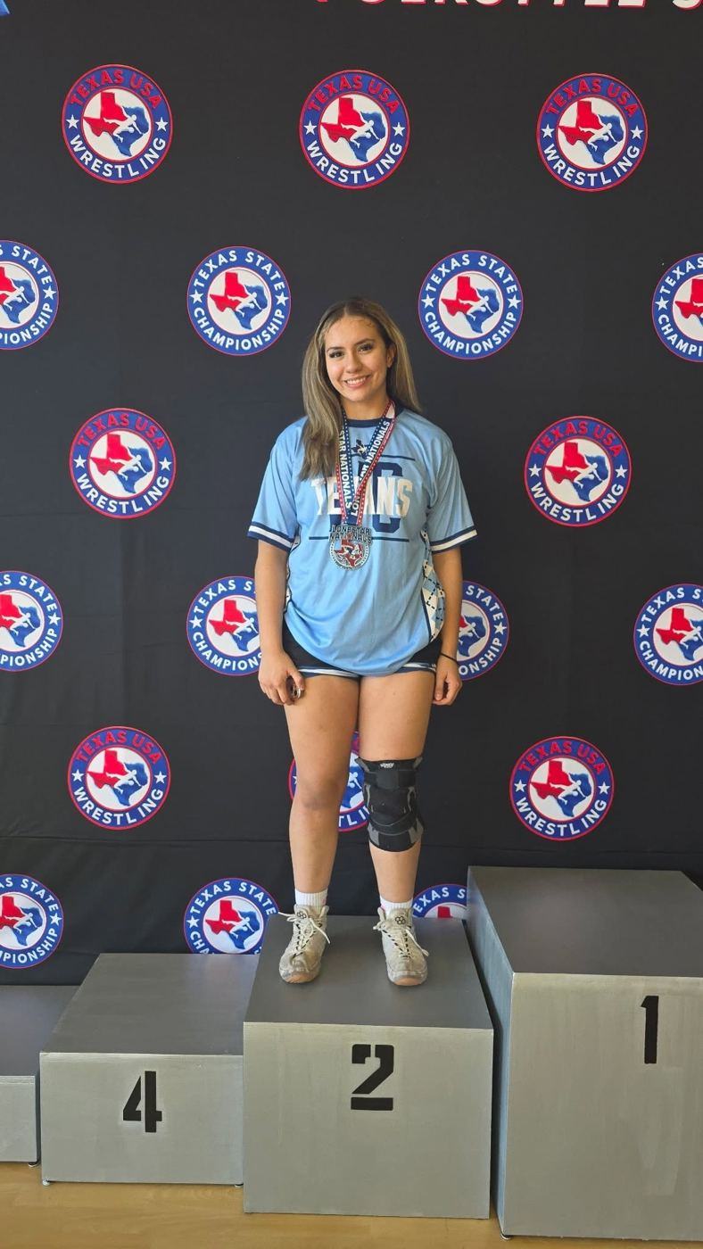 Bella on the second-place step of the state podium